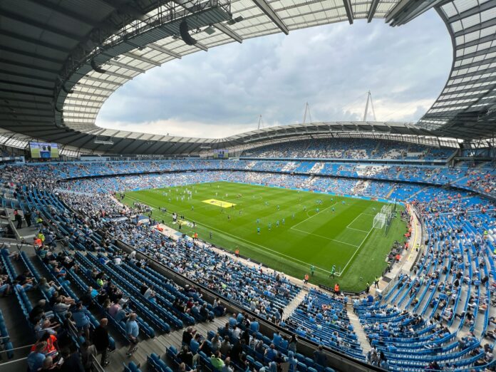 Etihad Stadium, home of Manchester City and flagship club of City Football Group, a leading example of multi-club ownership in football.