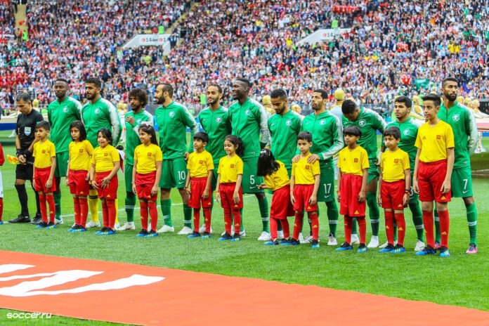 Saudi Arabia national football team players line up before a match, symbolizing the nation’s growing ambition ahead of hosting the 2034 FIFA World Cup.