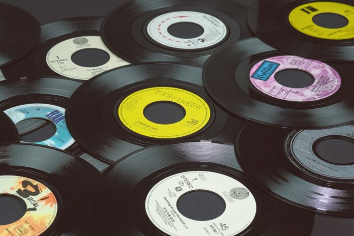 Vintage vinyl records symbolizing Ahmet Ertegün’s music legacy with Atlantic Records and the cultural backdrop of the New York Cosmos era.
