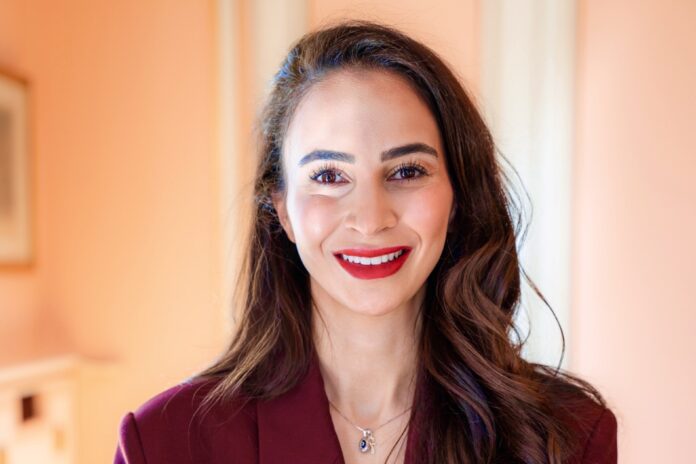 Berivan Çolak, football event director and global advocate for women in sport, smiling in a professional setting.