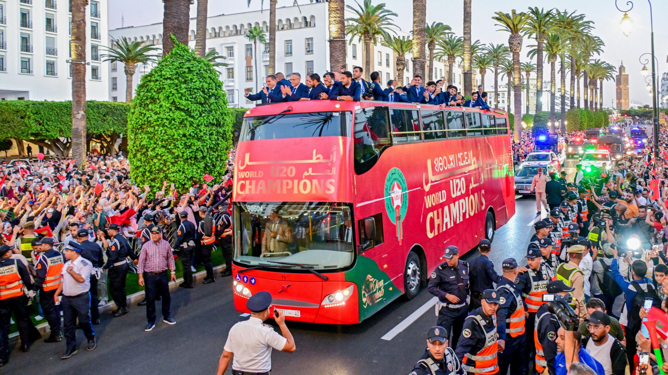 Morocco U20 national team celebrating their FIFA U20 World Cup victory with fans during the open-top bus parade in Rabat.