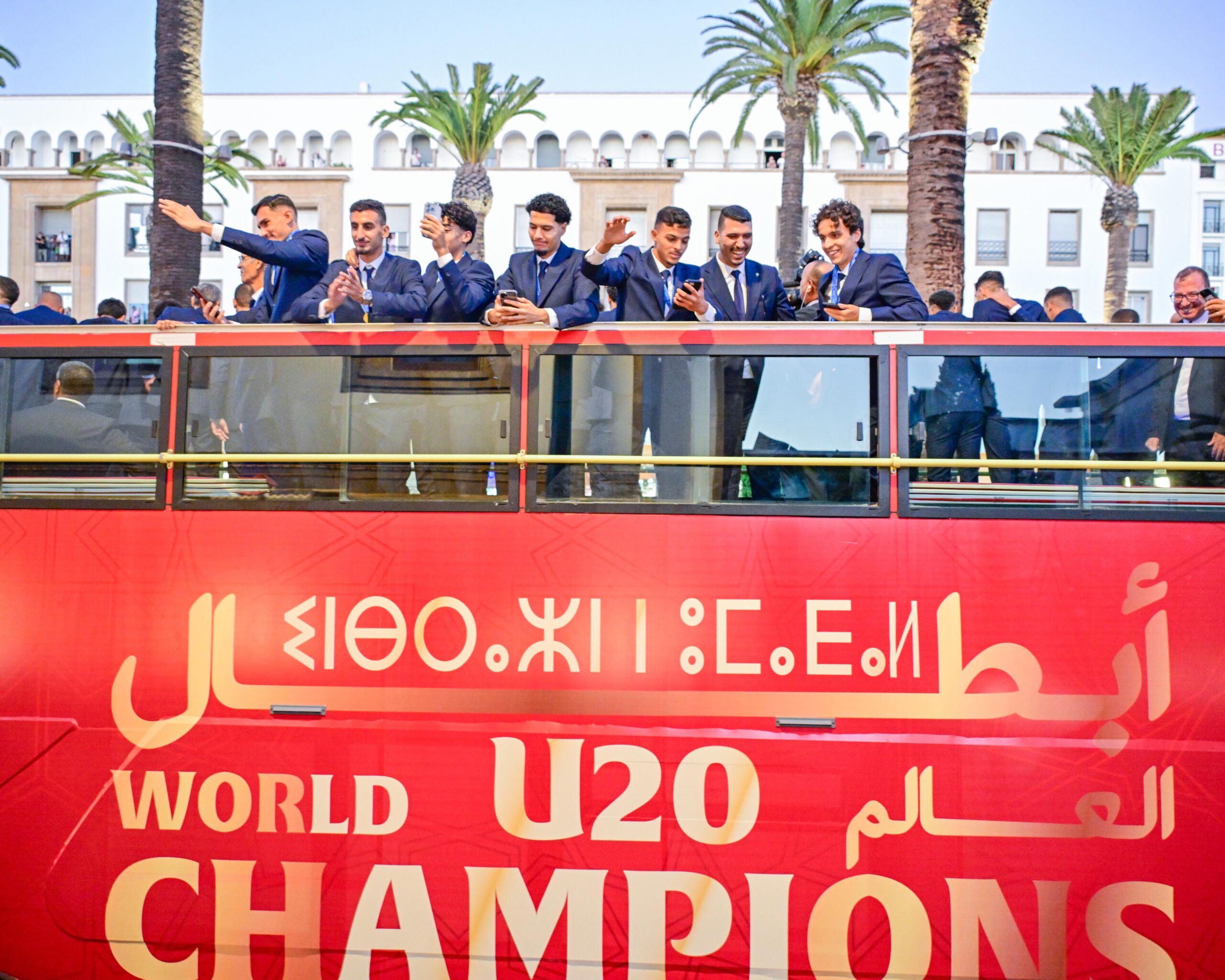 Moroccan U20 players celebrate their World Cup victory atop the champions’ bus.