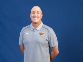 Who is Diego Vilela Alcalá? Diego Vilela Alcalá standing confidently in front of stadium seating, reflecting his work in player development and modern football methodology.