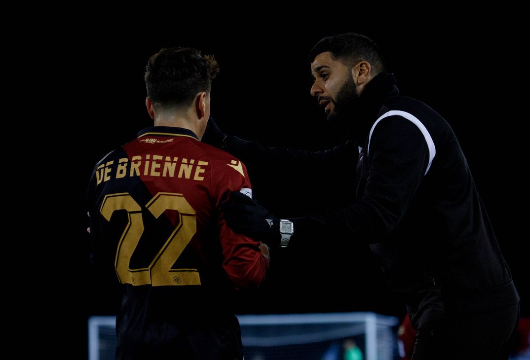 Jeyhan Bhindi gives tactical instructions to a player during a match