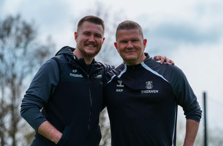 Kenneth Kretschmer Petersen standing with a colleague during a training session, highlighting his role in football recruitment and development.