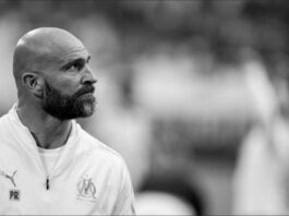 Paolo Rongoni observing the pitch with focus during his role as a top performance coach.
