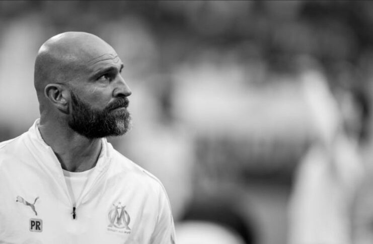 Paolo Rongoni observing the pitch with focus during his role as a top performance coach.