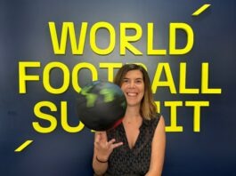 Who is Arantxa Mandiola? Arantxa Mandiola smiling in front of the World Football Summit backdrop while spinning a globe-themed football.