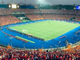 Egypt’s Youth Football Strategy Full stadium view during an AFCON match at Cairo International Stadium, showcasing Egypt's football passion.