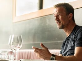 Who is Fredi Bobic? Fredi Bobic speaking during an interview at a restaurant, reflecting on his football and executive career.