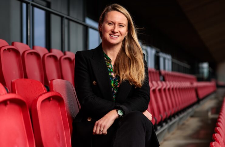 Lowri Roberts sits in the stands at Bristol City Women after being appointed Interim CEO under the new Mercury13 ownership.