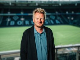 Bastian Huber, football executive and former technical director, pictured in a professional stadium environment.
