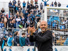 Patrice Gheisar applauds supporters during a matchday moment in the Canadian Premier League.