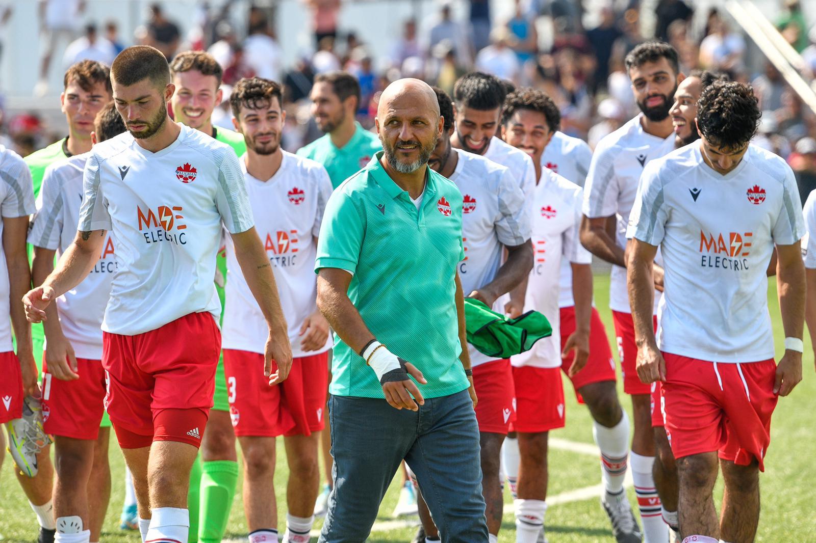 Patrice Gheisar walks with his players after a match, highlighting his leadership and team-first culture.
