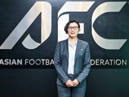Bai Lili at AFC headquarters discussing women’s football development in Asia