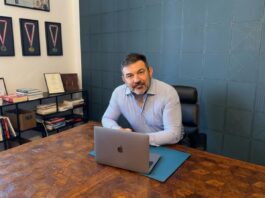 Hunor Dudás in his office discussing football leadership and management strategy.